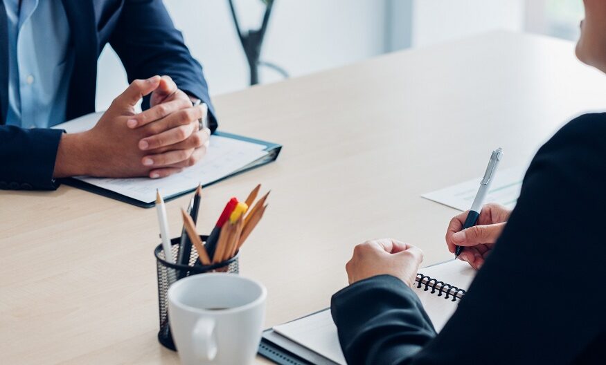 Close up interviewer interview candidate apply for job at meeting room in office.